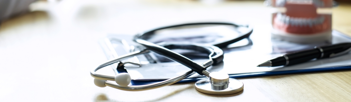 Stethoscope on table paperwork